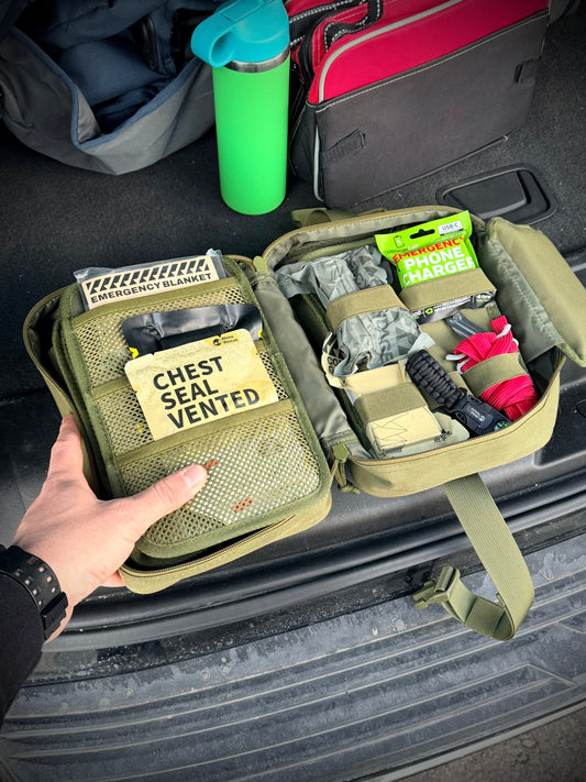 A person opening up the Wolf Packs Alpha Kit to look at the contents inside. 