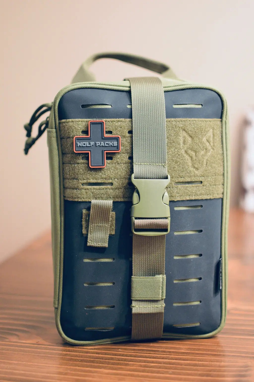 The Alpha First Aid Kit in olive green with MOLLE panel and front buckle